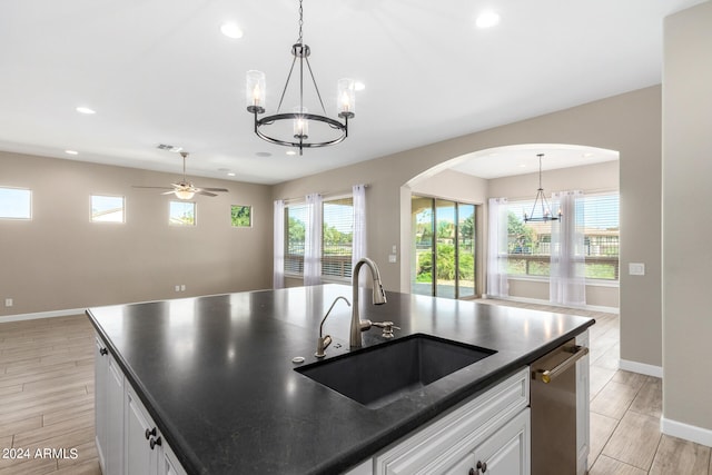 kitchen featuring white cabinets, sink, and a wealth of natural light