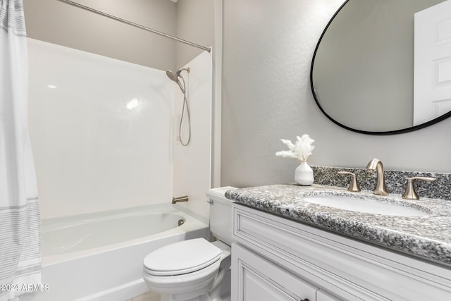 full bathroom with vanity, shower / bath combo with shower curtain, and toilet