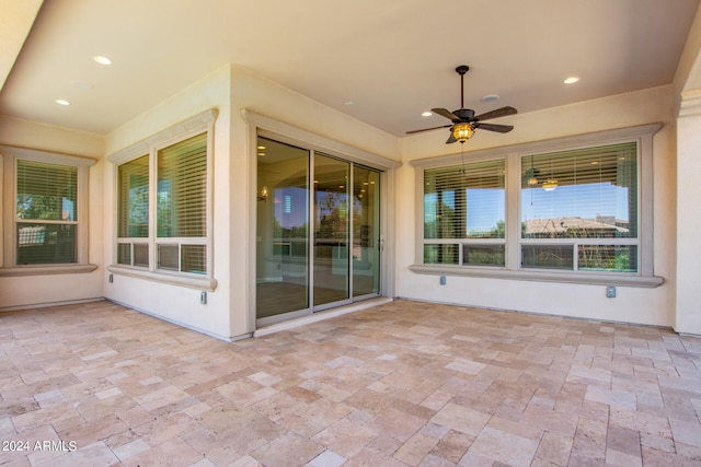 view of patio featuring ceiling fan