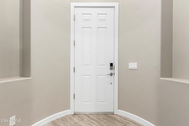 entryway with light hardwood / wood-style flooring