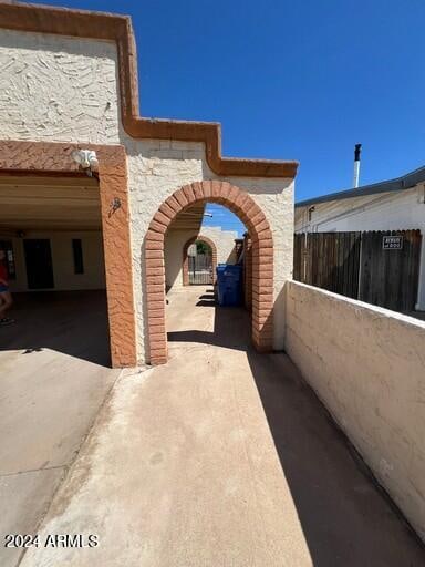 view of home's exterior with a carport