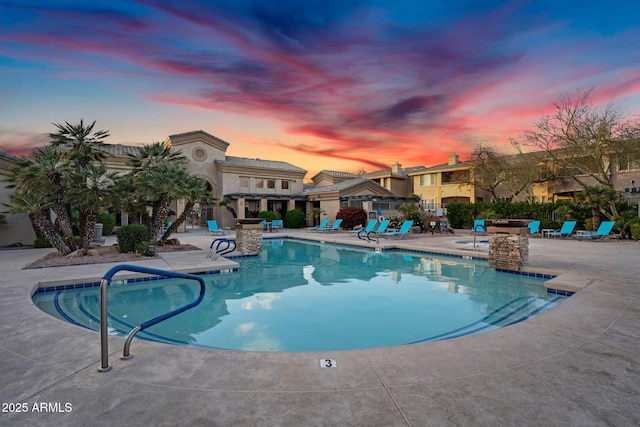 community pool with a patio area