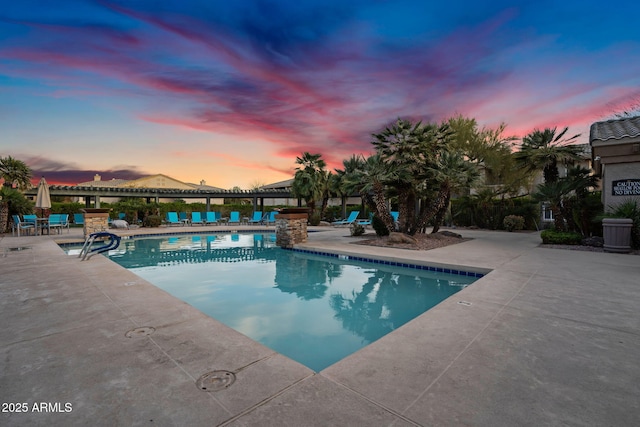 community pool with a patio area