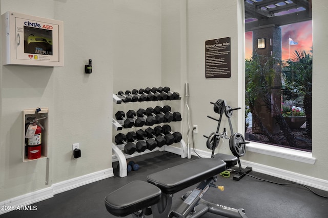 exercise room with baseboards