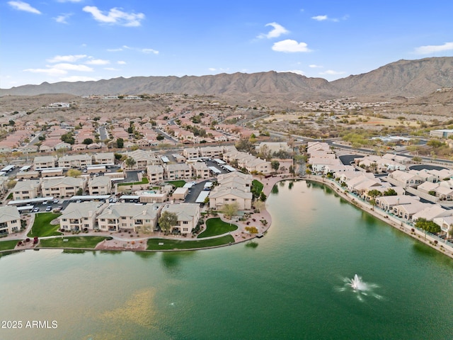 drone / aerial view with a residential view and a water and mountain view