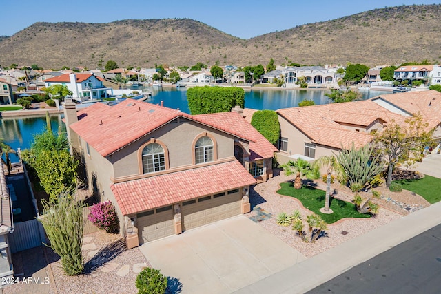 bird's eye view featuring a water and mountain view