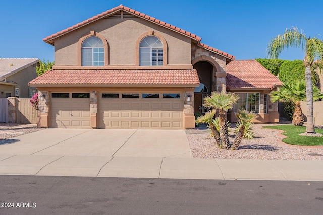 mediterranean / spanish house featuring a garage