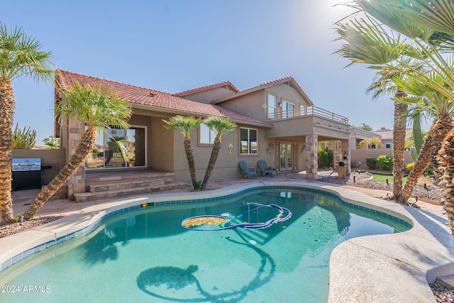 view of swimming pool featuring a patio area