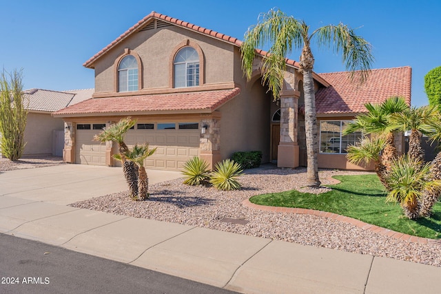 view of front of property with a garage