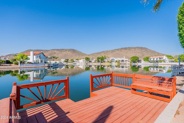 view of dock featuring a water and mountain view