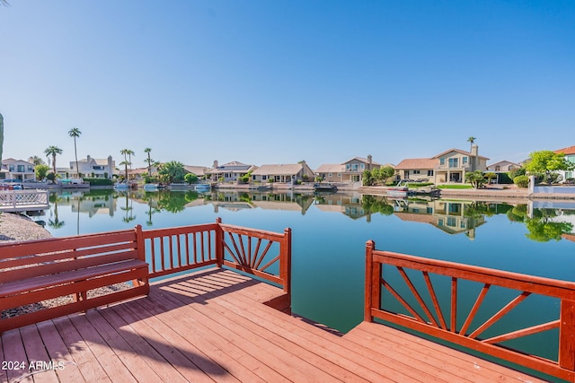 view of dock with a deck with water view