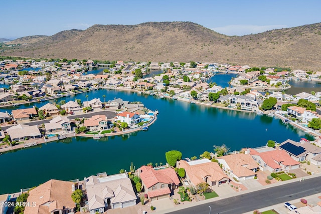 bird's eye view with a water and mountain view