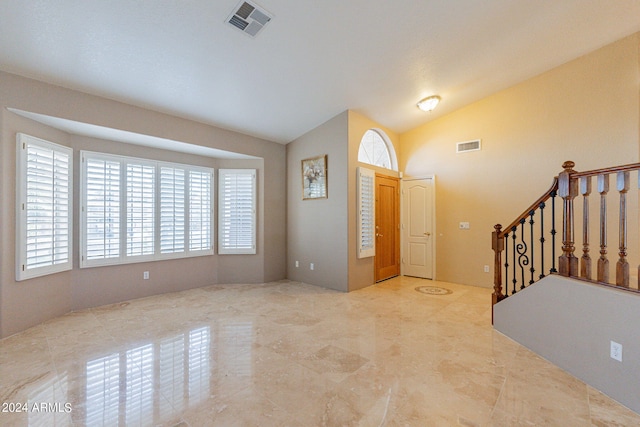 foyer entrance with lofted ceiling