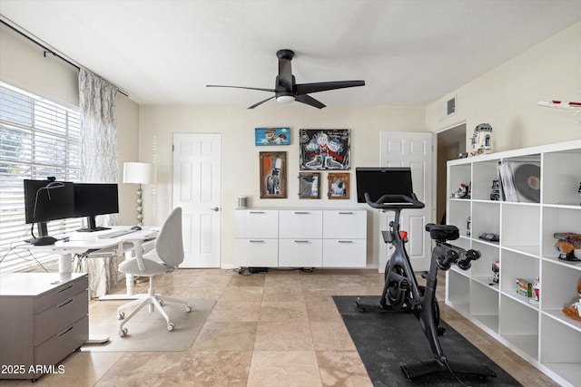 home office featuring visible vents and ceiling fan
