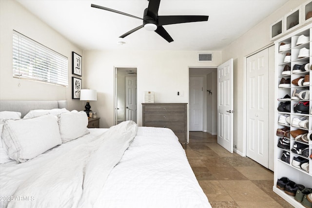 bedroom featuring visible vents and ceiling fan