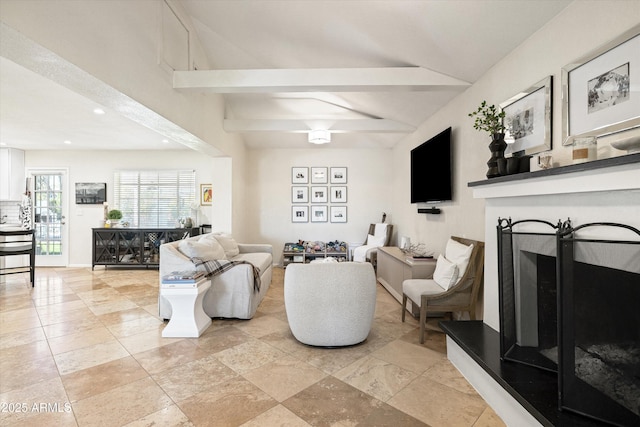 living area featuring recessed lighting, a fireplace with raised hearth, and lofted ceiling with beams