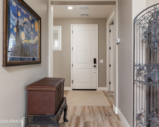 foyer with light wood-type flooring