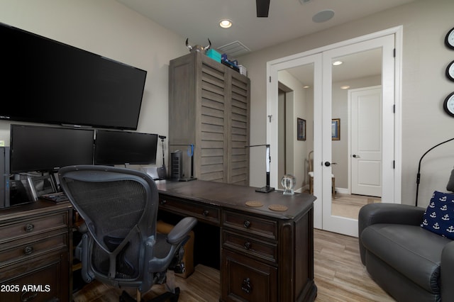 office area with french doors and light hardwood / wood-style floors