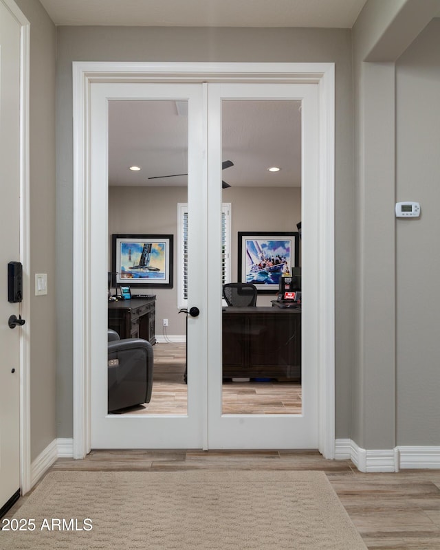 interior space featuring wood-type flooring and french doors