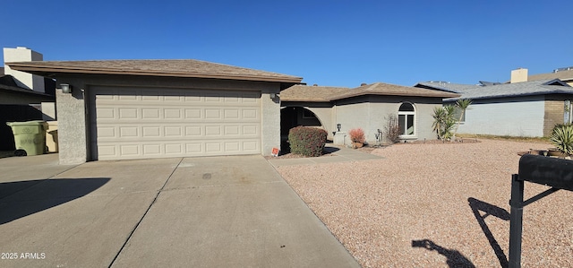 ranch-style house featuring a garage