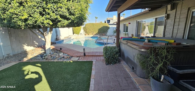 view of patio with a jacuzzi