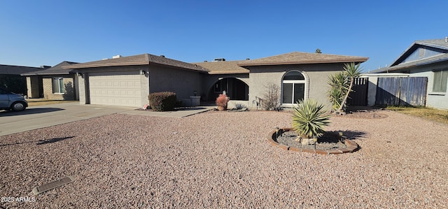 ranch-style house featuring a garage