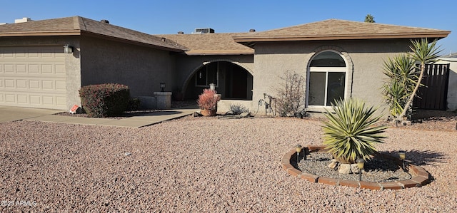 ranch-style home featuring a garage