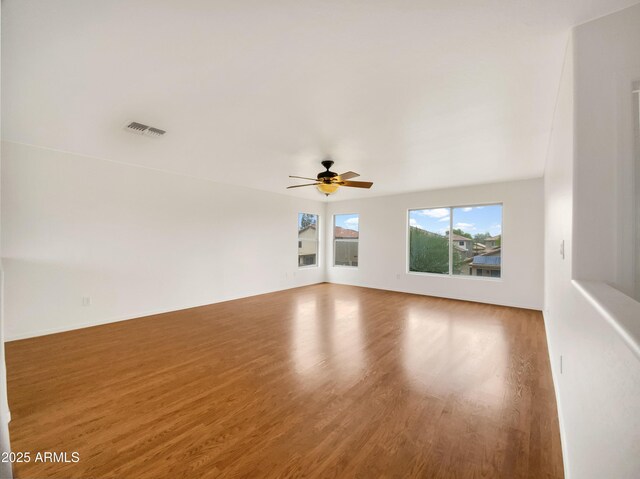 1078 E Poncho Ln, San Tan Valley, AZ 85143 - spare room with wood finished floors and a ceiling fan