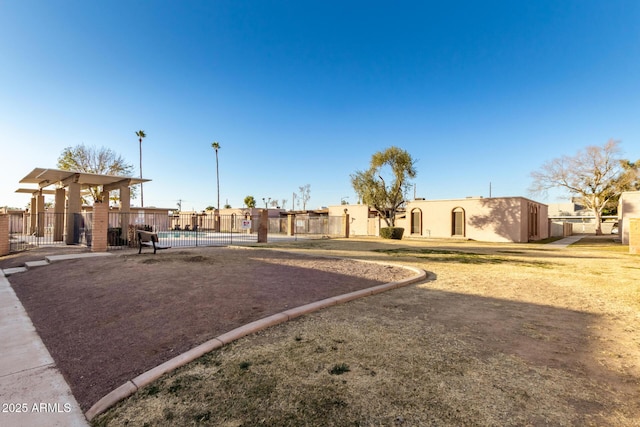 view of yard with a community pool