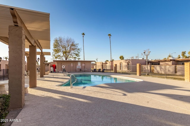 view of swimming pool with a patio