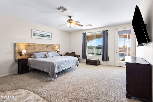 bedroom featuring visible vents, access to exterior, a ceiling fan, and carpet