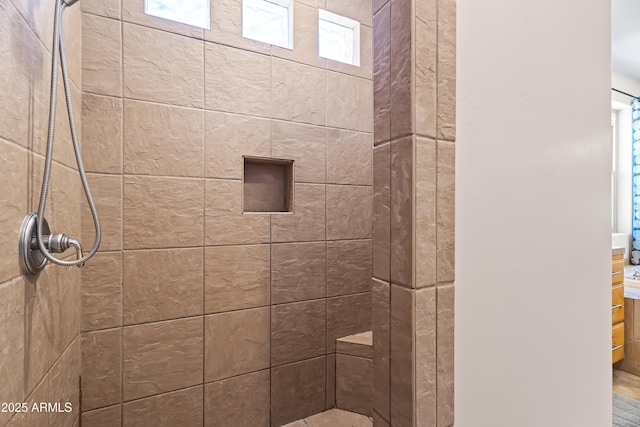 full bathroom with a tile shower