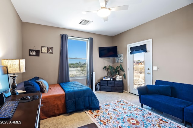 bedroom featuring visible vents, ceiling fan, carpet flooring, and access to exterior