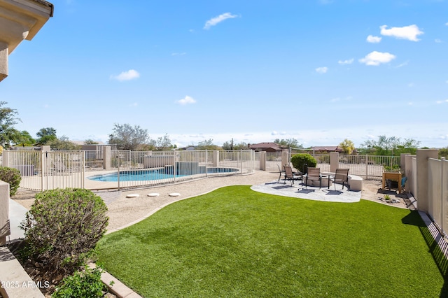 exterior space featuring a fenced in pool, a fenced backyard, and a patio area