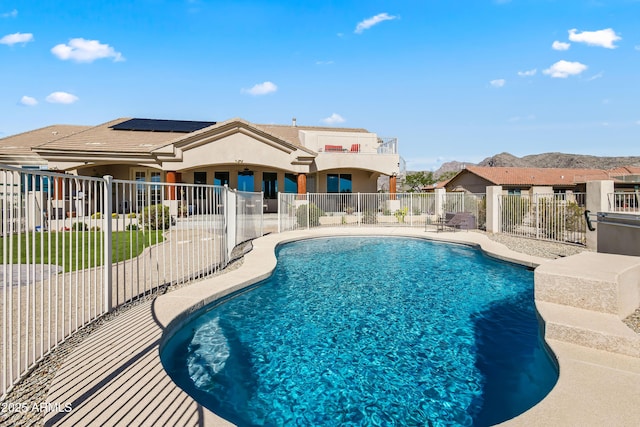 view of swimming pool featuring fence, a fenced in pool, and a patio area