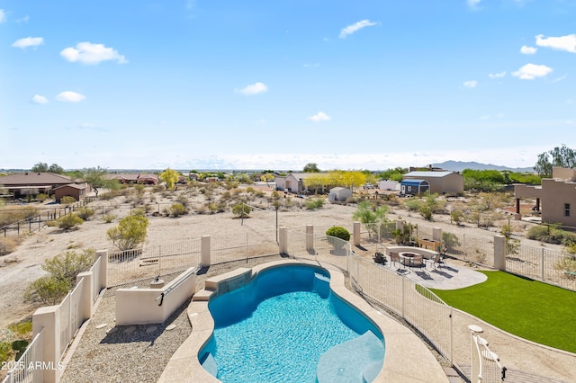 view of pool featuring a fire pit, a fenced backyard, and a patio area