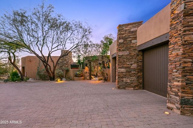 view of patio terrace at dusk