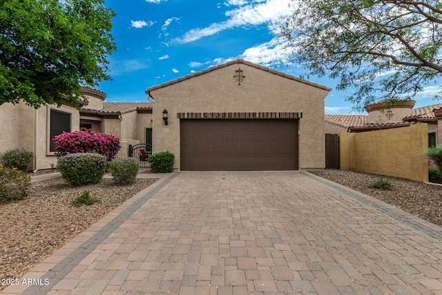 1813 N Trowbridge, Mesa, AZ 85207 - view of front facade featuring an attached garage, a tiled roof, stucco siding, and decorative driveway