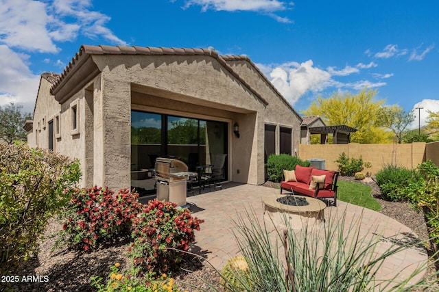 1813 N Trowbridge, Mesa, AZ 85207 - back of property featuring a tiled roof, fence, a patio area, an outdoor hangout area, and stucco siding