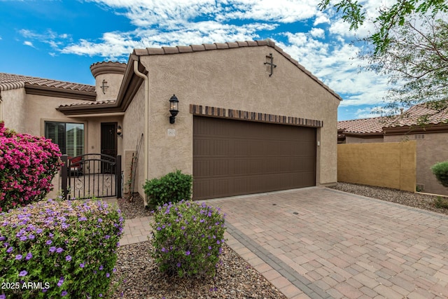 1813 N Trowbridge, Mesa, AZ 85207 - view of front of home with a tiled roof, fence, a garage, stucco siding, and decorative driveway