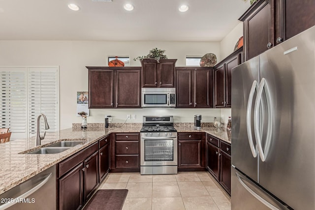 1813 N Trowbridge, Mesa, AZ 85207 - kitchen with stainless steel appliances, a sink, light tile patterned flooring, dark brown cabinetry, and light stone counters