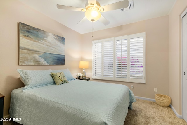 bedroom featuring visible vents, a ceiling fan, baseboards, and carpet floors