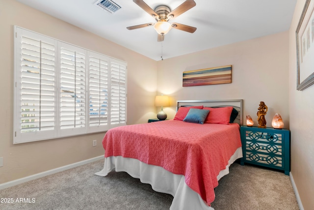 carpeted bedroom featuring a ceiling fan, baseboards, and visible vents
