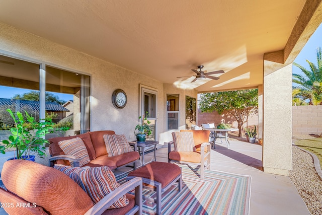 view of patio / terrace featuring an outdoor hangout area, fence, outdoor dining space, and a ceiling fan