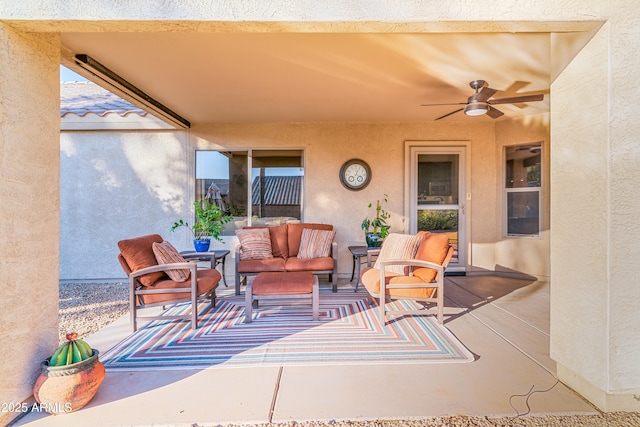 view of patio featuring an outdoor living space and a ceiling fan