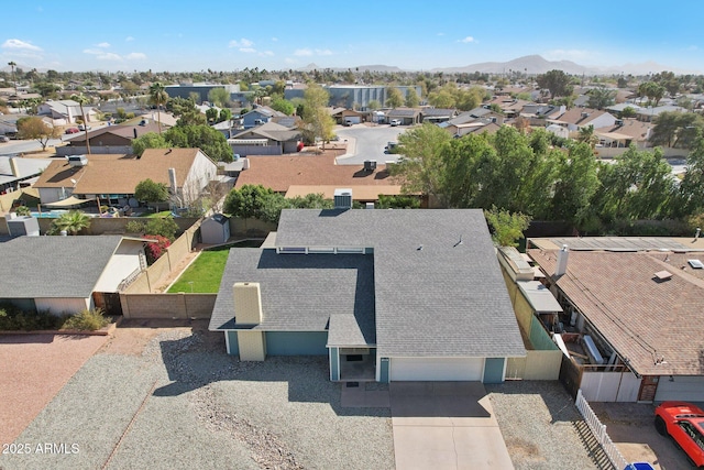 birds eye view of property featuring a mountain view and a residential view