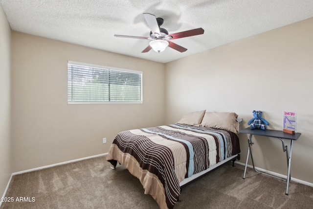 bedroom featuring baseboards, carpet, a ceiling fan, and a textured ceiling