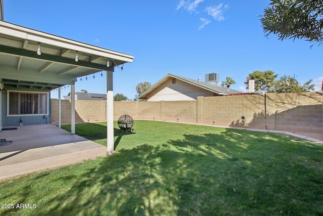 view of yard with cooling unit, a patio, and a fenced backyard