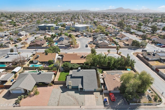 drone / aerial view with a residential view and a mountain view