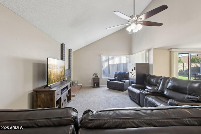 carpeted living room with baseboards, high vaulted ceiling, and ceiling fan